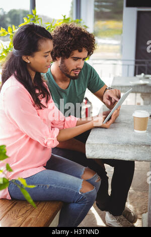 Couple using digital tablet Stock Photo