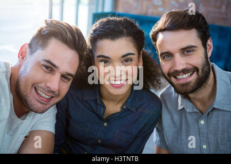 Portrait of three smiling friends Stock Photo