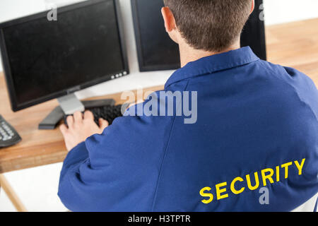 Security officer using computer Stock Photo