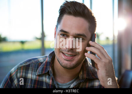 Handsome man talking on the phone Stock Photo