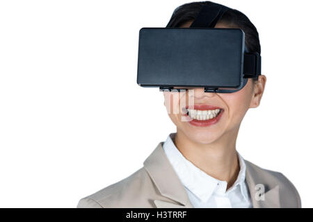 Businesswoman using virtual reality headset Stock Photo
