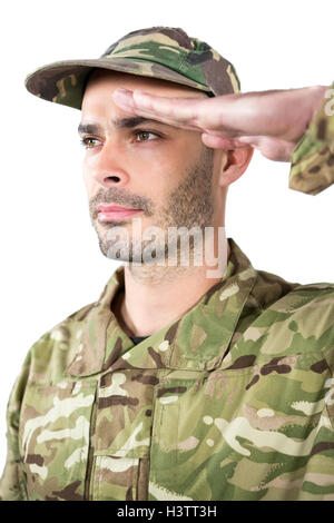 Close up of confident soldier saluting against dark background Stock ...