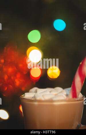 Cup of coffee with marshmallow and candy cane Stock Photo