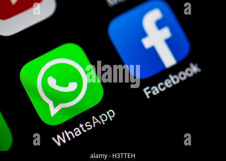 Smartphone screen with WhatsApp and Facebook app icons Stock Photo