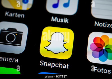 Smartphone screen display with Photos and Snapchat app icons in detail Stock Photo