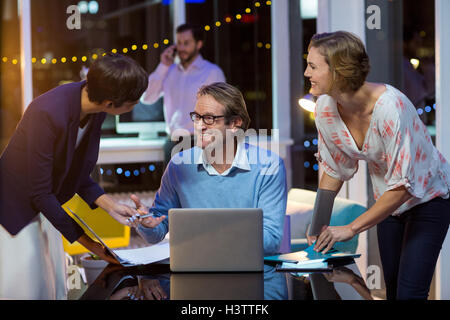 Businesspeople interacting with each other Stock Photo