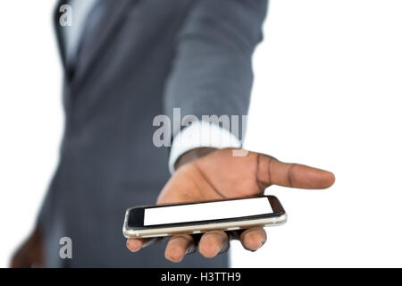 Businessman holding mobile phone Stock Photo