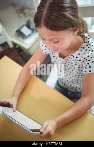 Girl using digital tablet Stock Photo