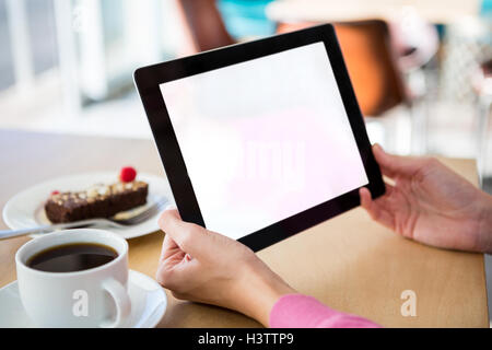Woman holding a digital tablet in the coffee shop Stock Photo