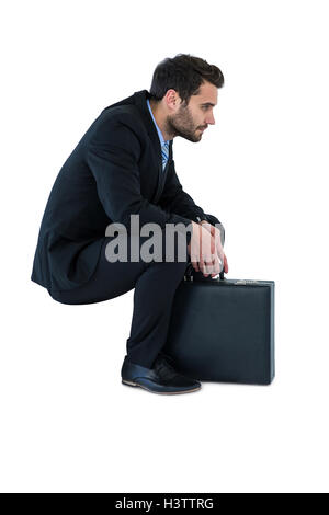Businessman sitting on steps Stock Photo