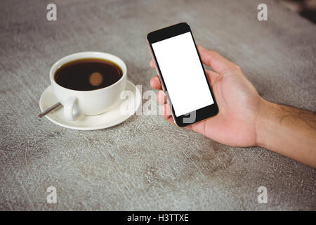 Hand of man holding mobile phone Stock Photo
