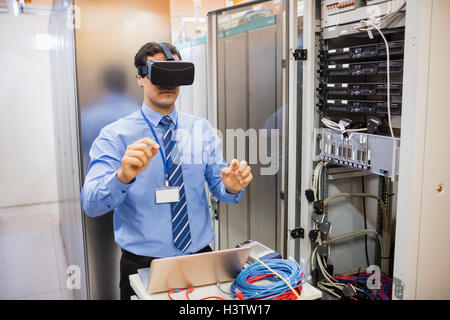 Technician using visual reality headset Stock Photo