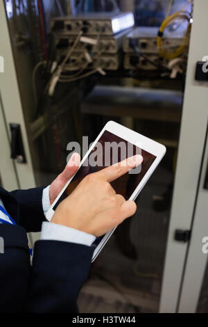 Technician using digital tablet Stock Photo
