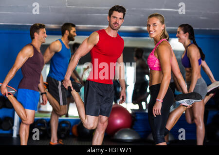Happy athletes standing on one leg Stock Photo