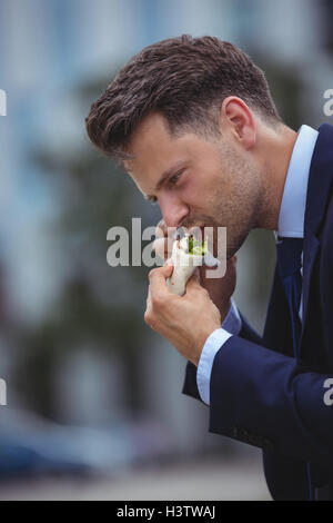 Handsome businessman talking on mobile phone Stock Photo