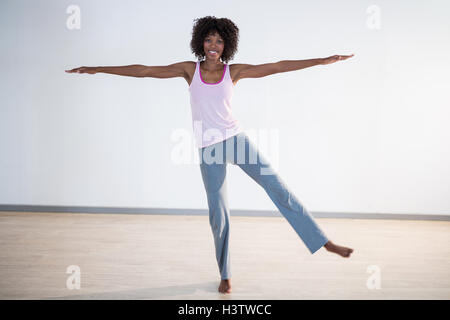Woman performing stretching exercise Stock Photo