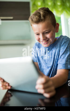 Boy using digital tablet at home Stock Photo