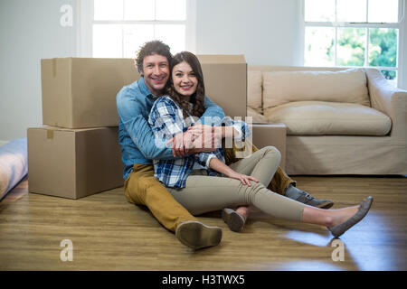 Couple sitting on the floor Stock Photo