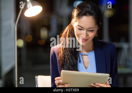 Businesswoman using digital tablet Stock Photo
