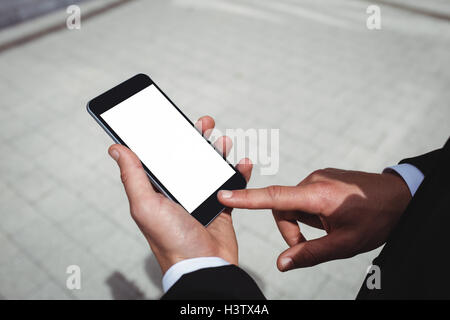 Businessman using mobile phone Stock Photo