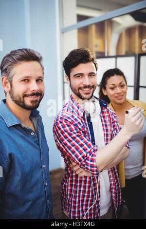 Portrait of confident business partners at creative office Stock Photo