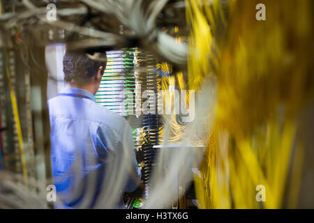 Technician checking routers Stock Photo