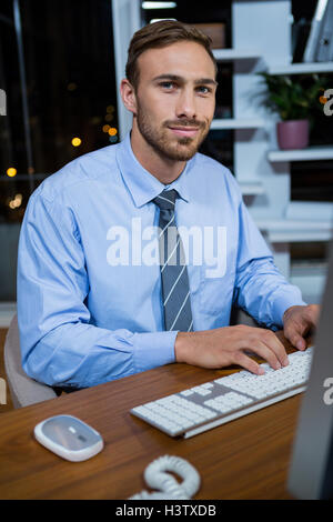 Business executive working on computer in office Stock Photo