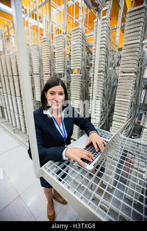 Technician using laptop Stock Photo