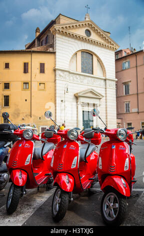 Three Vespa scooters at Piazza di San Pantaleo in Rome, Italy Stock Photo