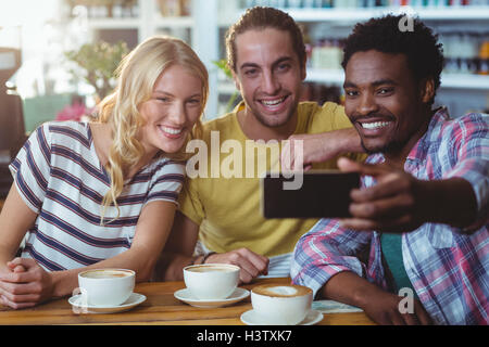 Three friends taking a selfie Stock Photo