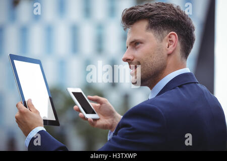 Businessman using digital tablet Stock Photo