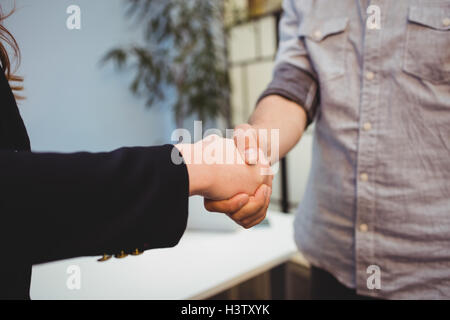 Cropped image of business people shaking hands Stock Photo