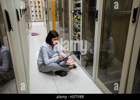 Technician using digital tablet Stock Photo