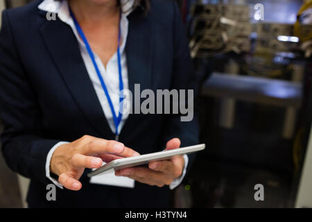 Technician using digital tablet Stock Photo