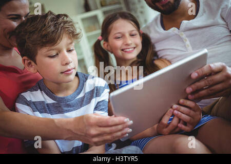 Family using a digital tablet Stock Photo
