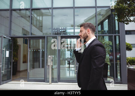 Businessman talking on mobile phone Stock Photo