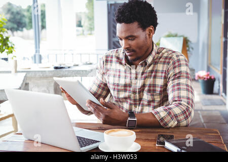 Man using digital tablet Stock Photo