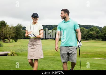 Couple interacting with each other while walking Stock Photo