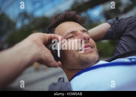 Handsome business executive talking on mobile phone Stock Photo