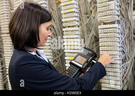 Technician using digital cable analyzer Stock Photo