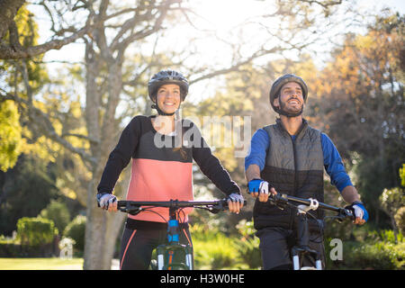 Biker couple cycling in countryside Stock Photo