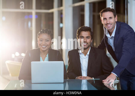 Businesspeople sitting in a meeting in the conference room Stock Photo