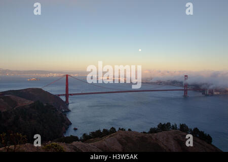 Full moon shining over the Golden Gate Bridge in San Francisco, California, USA. Stock Photo