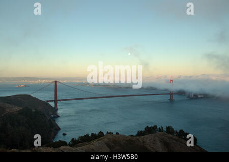 Full moon shining over the Golden Gate Bridge in San Francisco, California, USA. Stock Photo