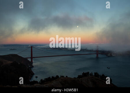 Full moon shining over the Golden Gate Bridge in San Francisco, California, USA. Stock Photo