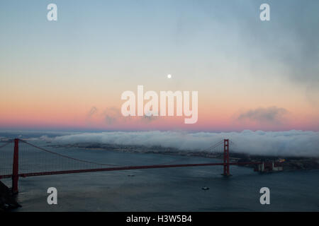 Full moon shining over the Golden Gate Bridge in San Francisco, California, USA. Stock Photo