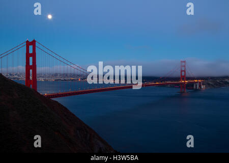 Full moon shining over the Golden Gate Bridge in San Francisco, California, USA. Stock Photo