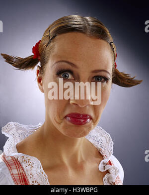 Woman, young, dirndl, Dekollete, facial play, estimating, half portrait, women, cut out, studio, fiercely, nastily, angrily, rage, furiously, fury, craftily, mockingly, smugly, arrogantly, plaits, Stock Photo