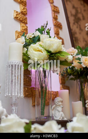 bouquet of white peonies in vase decorated for a wedding dinner Stock Photo