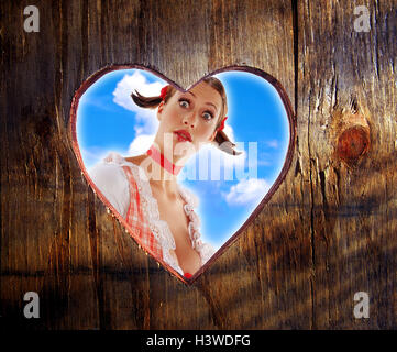wooden wall, notch, heart-shaped, woman, young, dirndls, view, facial play, is surprised, surprises, portrait, concepts, toilet small houses, wooden door, window, heart, heart form, girl, national costume, clothes, in Bavarian, national costume, Dekollete, see, look, see through, astonished, surprise, cloudy sky, studio in Bavarian, dirndls, dirndl, Dekollete, surprises, wooden door, toilet small house, cloudy sky, heaven, clouds, Stock Photo
